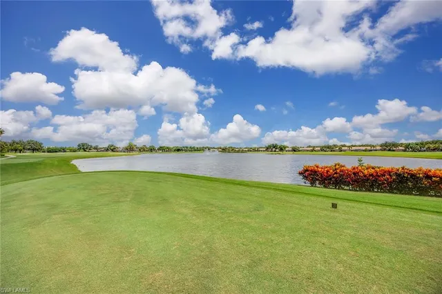 a view of a golf course with a lake