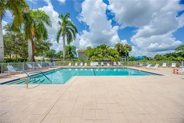 a view of a swimming pool with a lounge chair