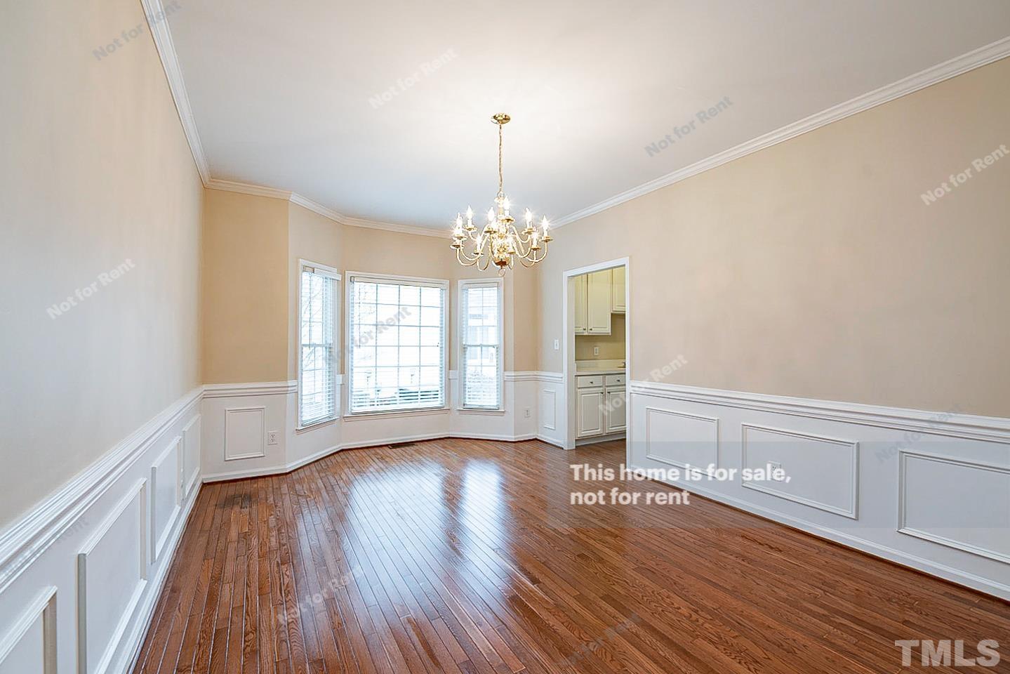 2340 Bolingbrook Lane Raleigh, NC 27613 - Photo 12 of 24 a view of an empty room with wooden floor and a window
