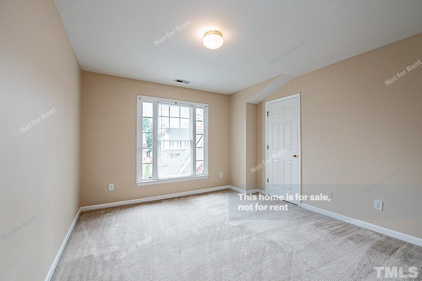 2340 Bolingbrook Lane Raleigh, NC 27613 - Photo 17 of 24 an empty room with windows and closet
