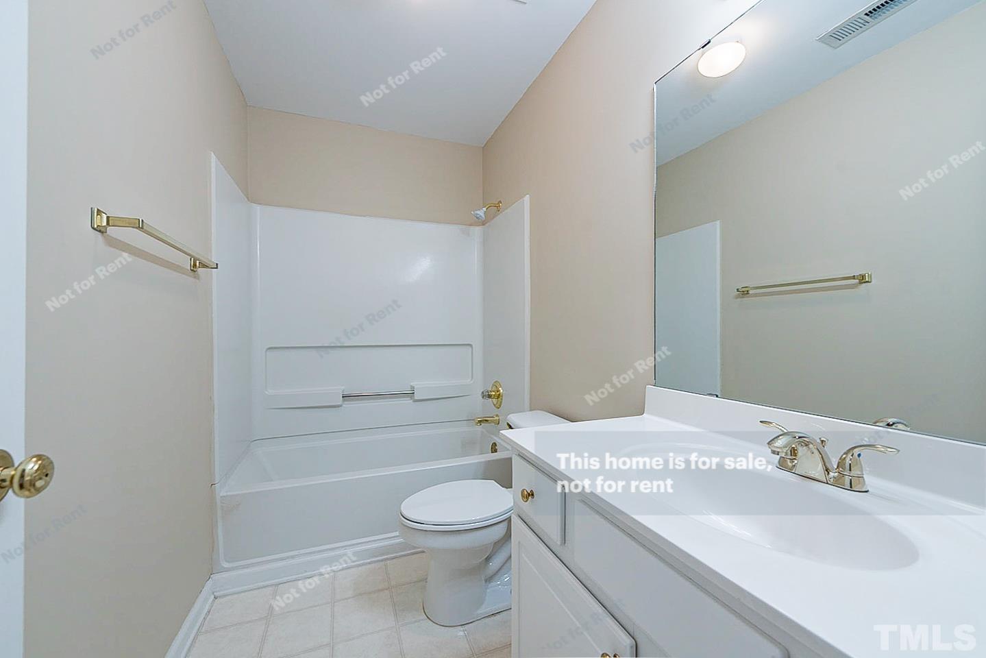2340 Bolingbrook Lane Raleigh, NC 27613 - Photo 20 of 24 a bathroom with a sink a toilet and shower