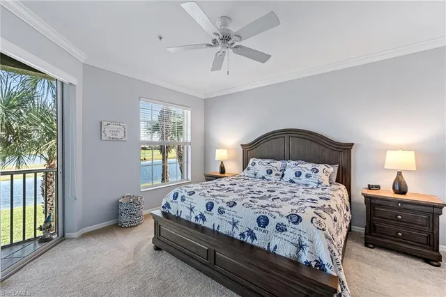 a bedroom with a bed and a ceiling fan