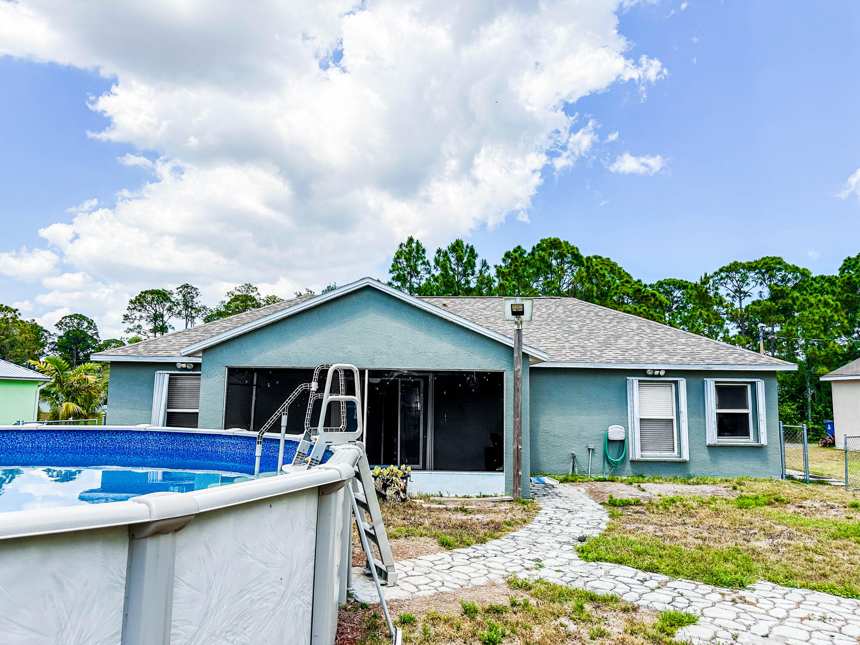 816 Tedder Road Southeast Palm Bay, FL 32909 - Photo 13 of 15 a front view of a house with garden