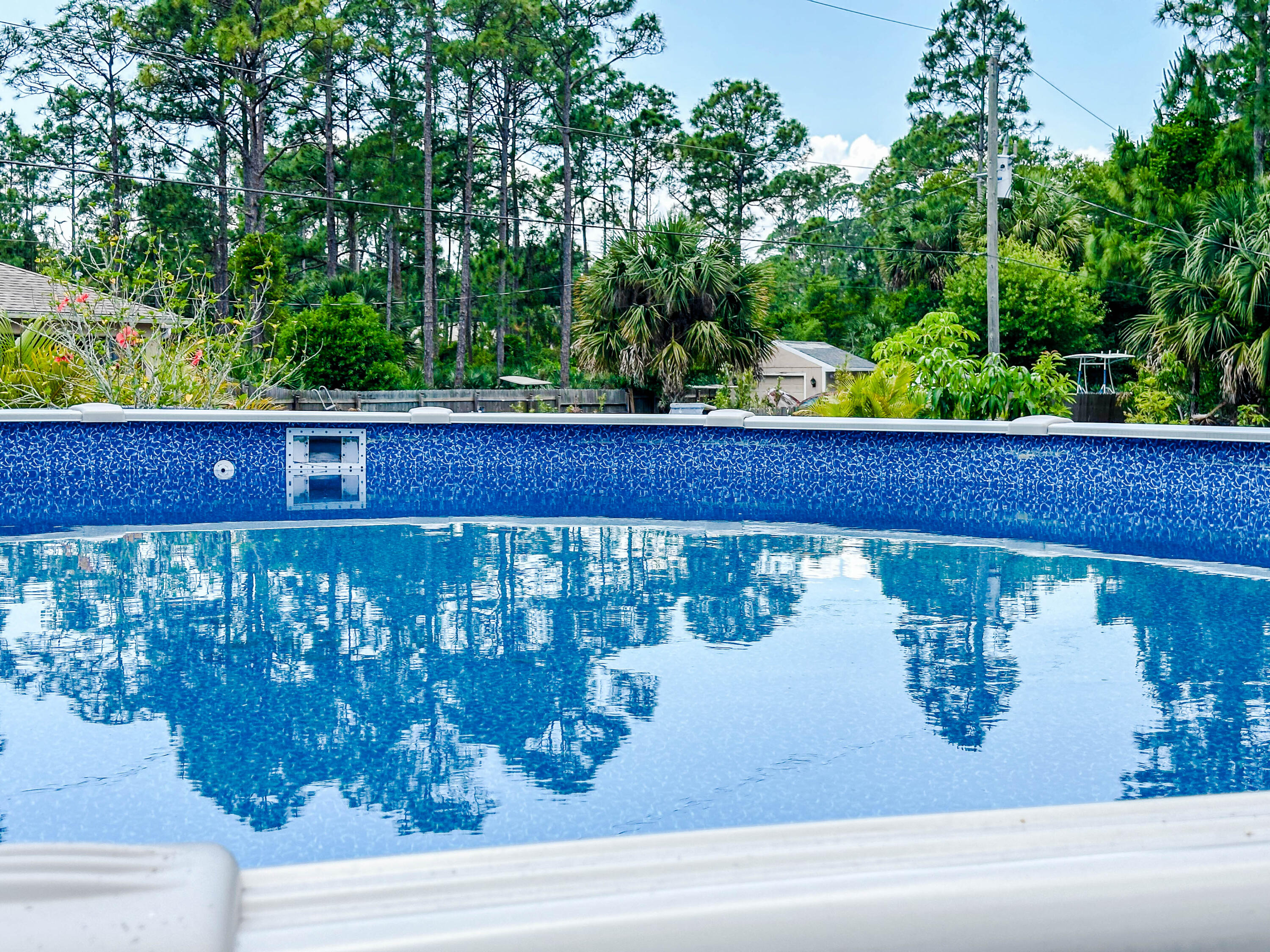 816 Tedder Road Southeast Palm Bay, FL 32909 - Photo 14 of 15 a wooden bench sitting in front of a building