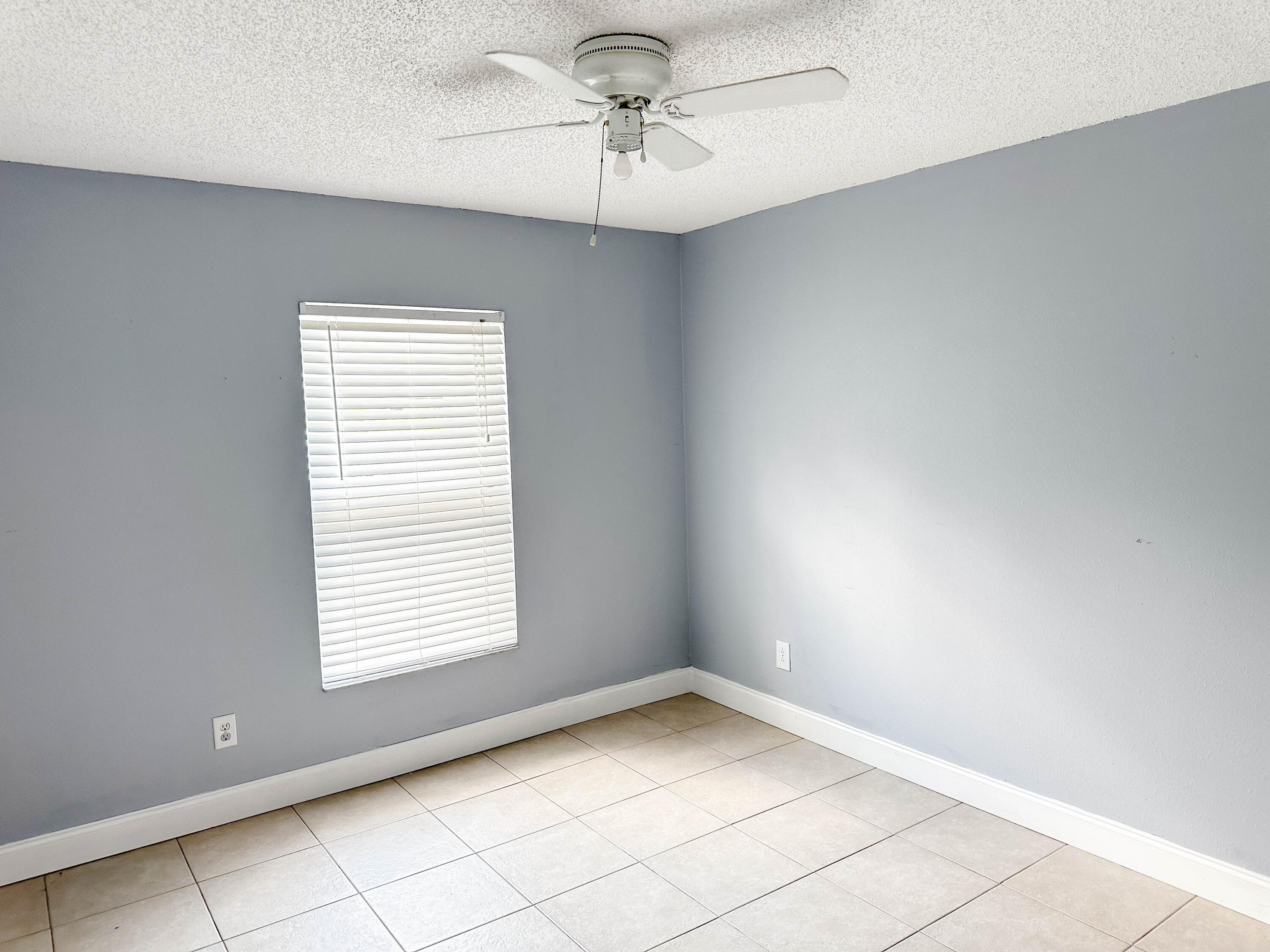 816 Tedder Road Southeast Palm Bay, FL 32909 - Photo 9 of 15 a view of an empty room with a window