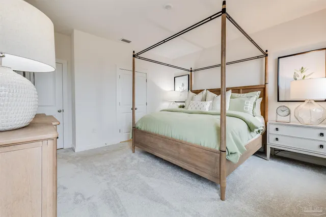 a bedroom with a bed and a dresser