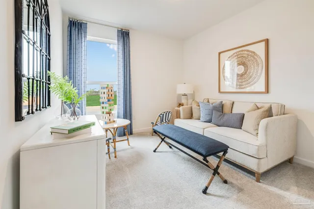 a living room with furniture and a window