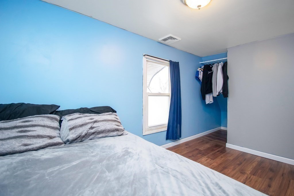 220 Nottingham Street Springfield, MA 01104 - Photo 21 of 30 a bedroom with a bed and a window