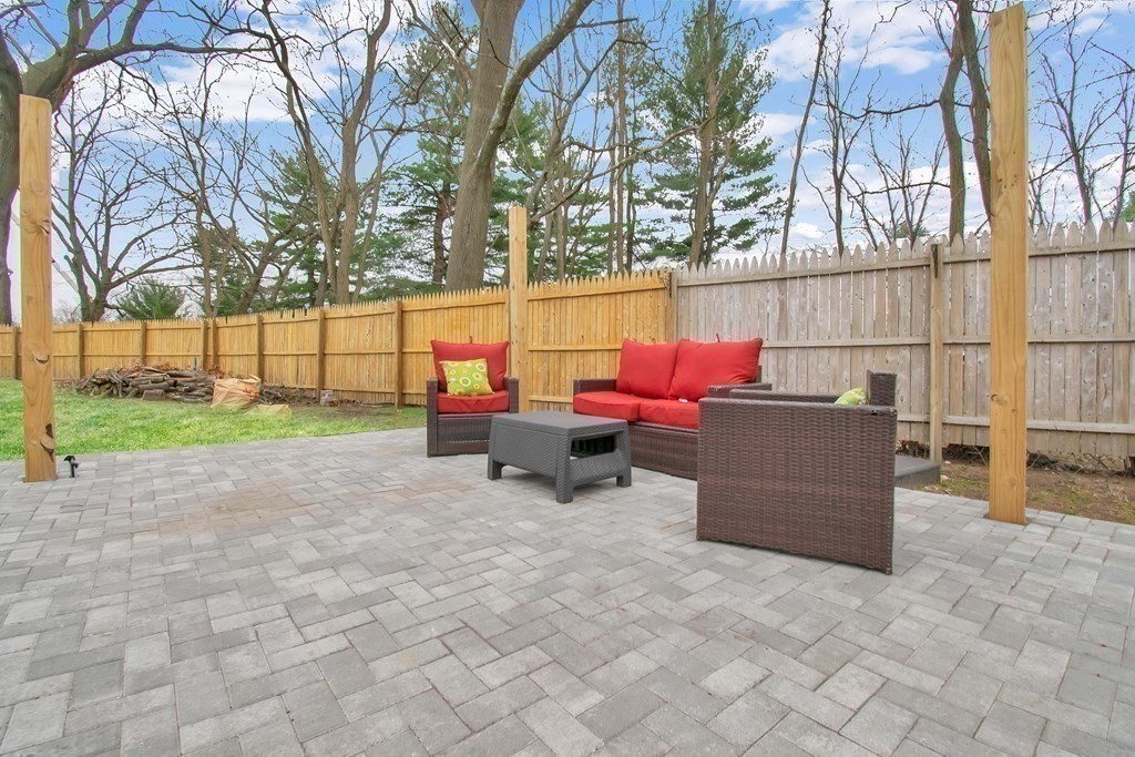 220 Nottingham Street Springfield, MA 01104 - Photo 26 of 30 a backyard of a house with table and chairs
