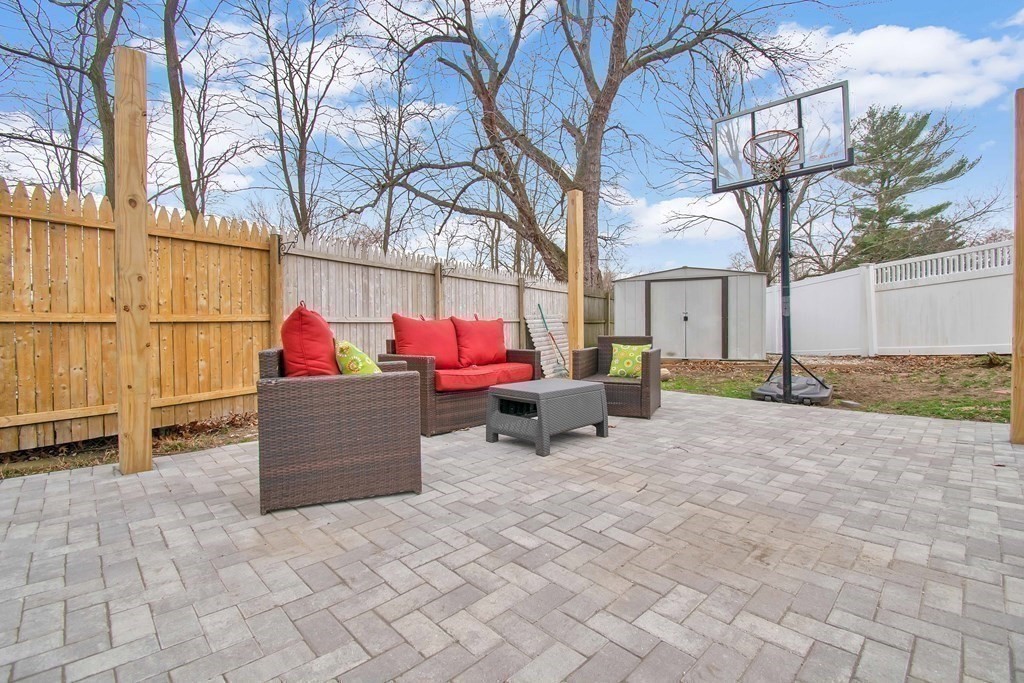 220 Nottingham Street Springfield, MA 01104 - Photo 28 of 30 a view of a yard with a patio