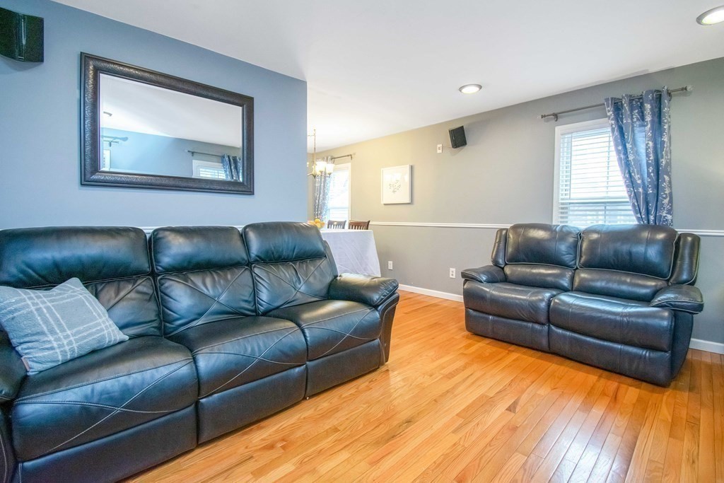 220 Nottingham Street Springfield, MA 01104 - Photo 5 of 30 a living room with a couch and a window