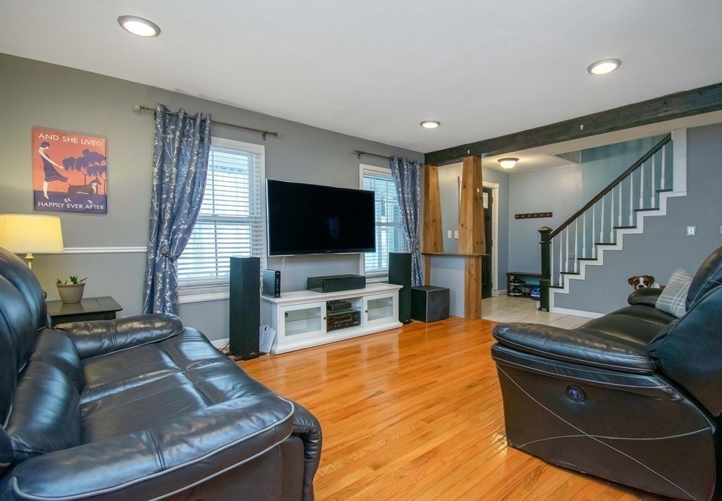 220 Nottingham Street Springfield, MA 01104 - Photo 6 of 30 a living room with furniture and a flat screen tv