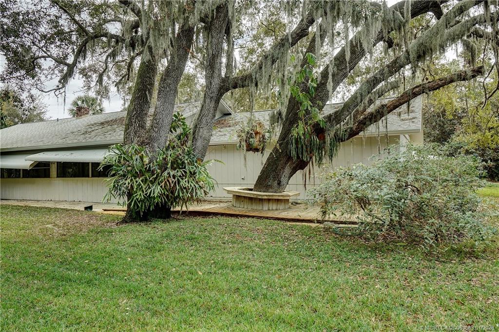 4 Miramar Road Sewall's Point, FL 34996 - Photo 28 of 31 a view of a garden with a tree