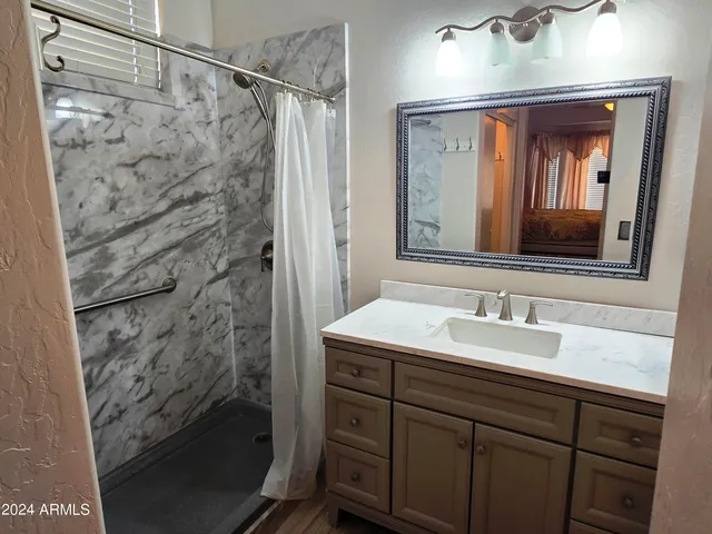 a bathroom with a sink and a mirror
