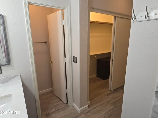 a view of a bathroom from a hallway