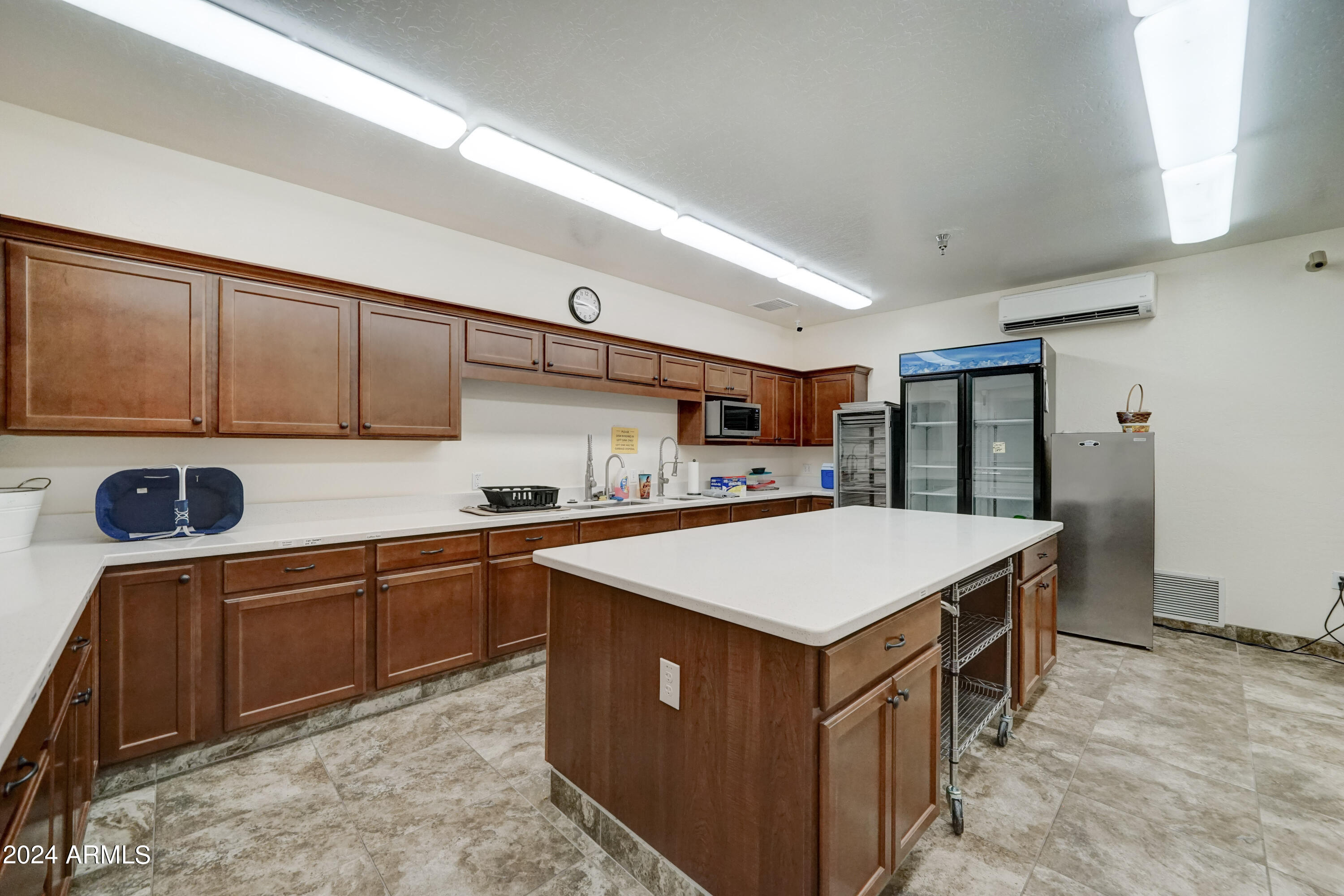 2101 South Meridian Road, Unit 34 Apache Junction, AZ 85120 - Photo 47 of 59 a kitchen with stainless steel appliances granite countertop a sink counter space and cabinets