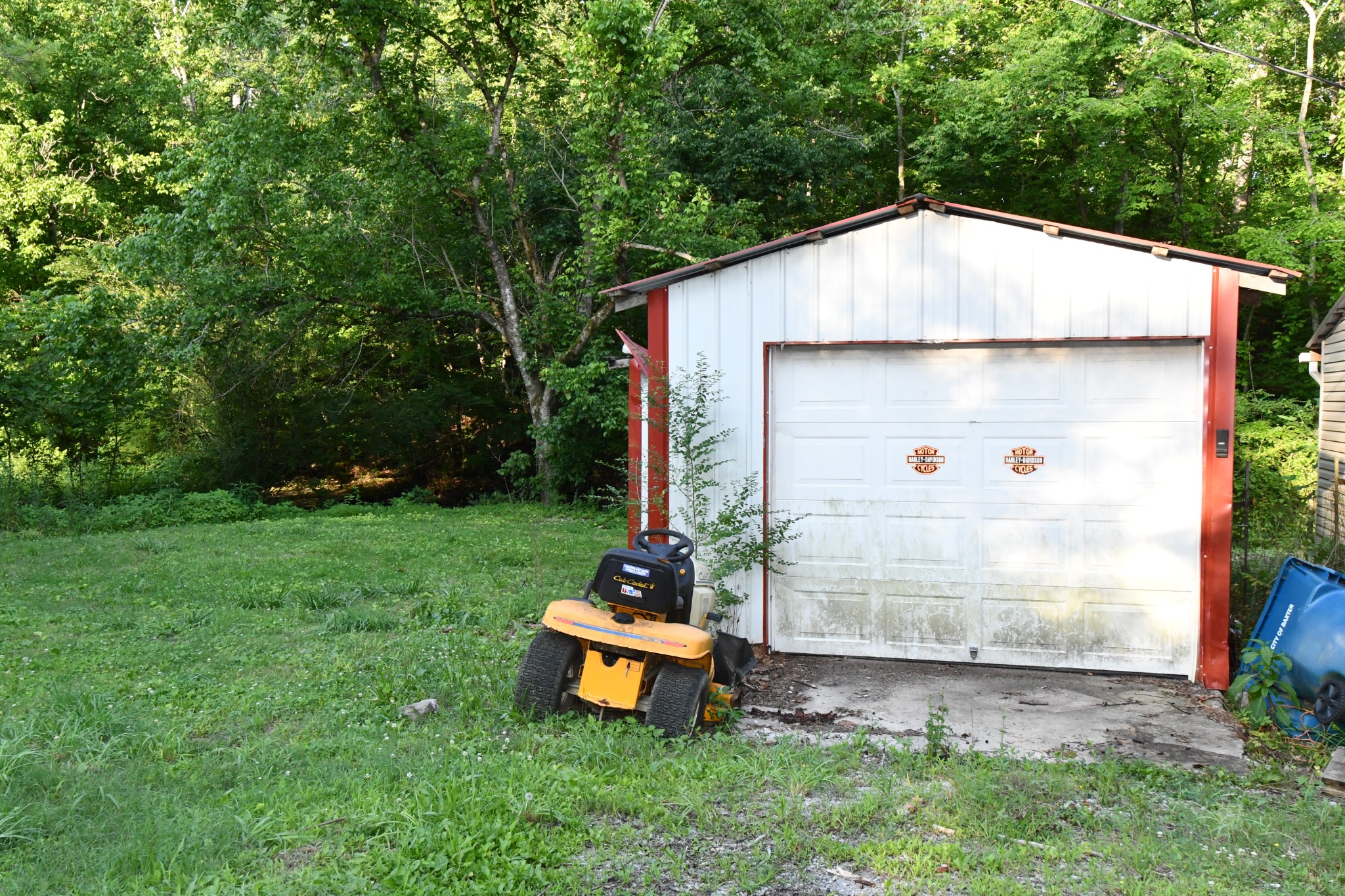 398 Elmore Town Road Baxter, TN 38544 - Photo 3 of 5 a backyard of a house with table and chairs swing