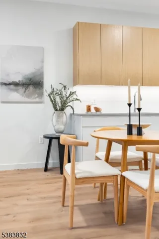 a view of a kitchen with kitchen island table and chairs