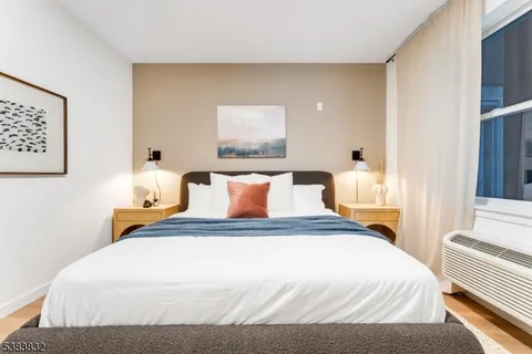 a bedroom with bed and window