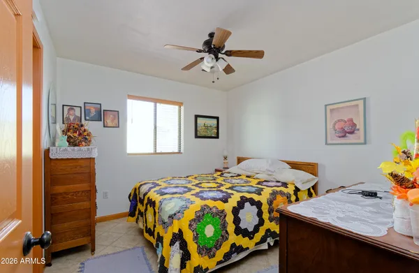 a bedroom that has a bed and a table in it