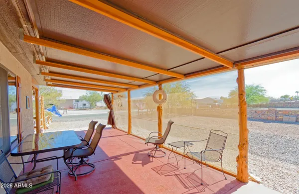 a work room with large glass windows and furniture
