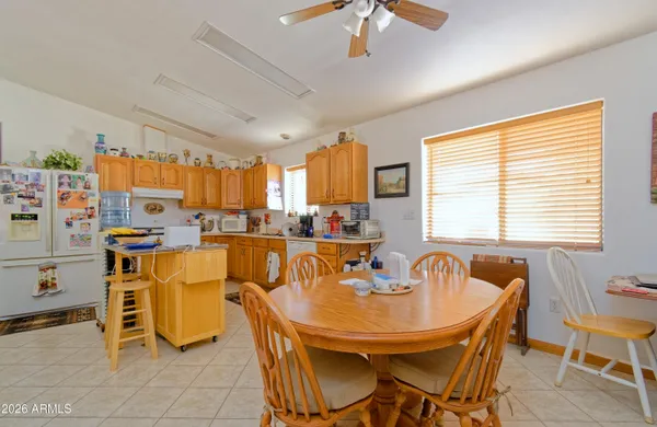 a view of a dining room with furniture and a chandelier
