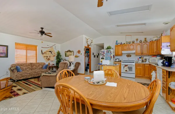 a dining room with furniture and a chandelier