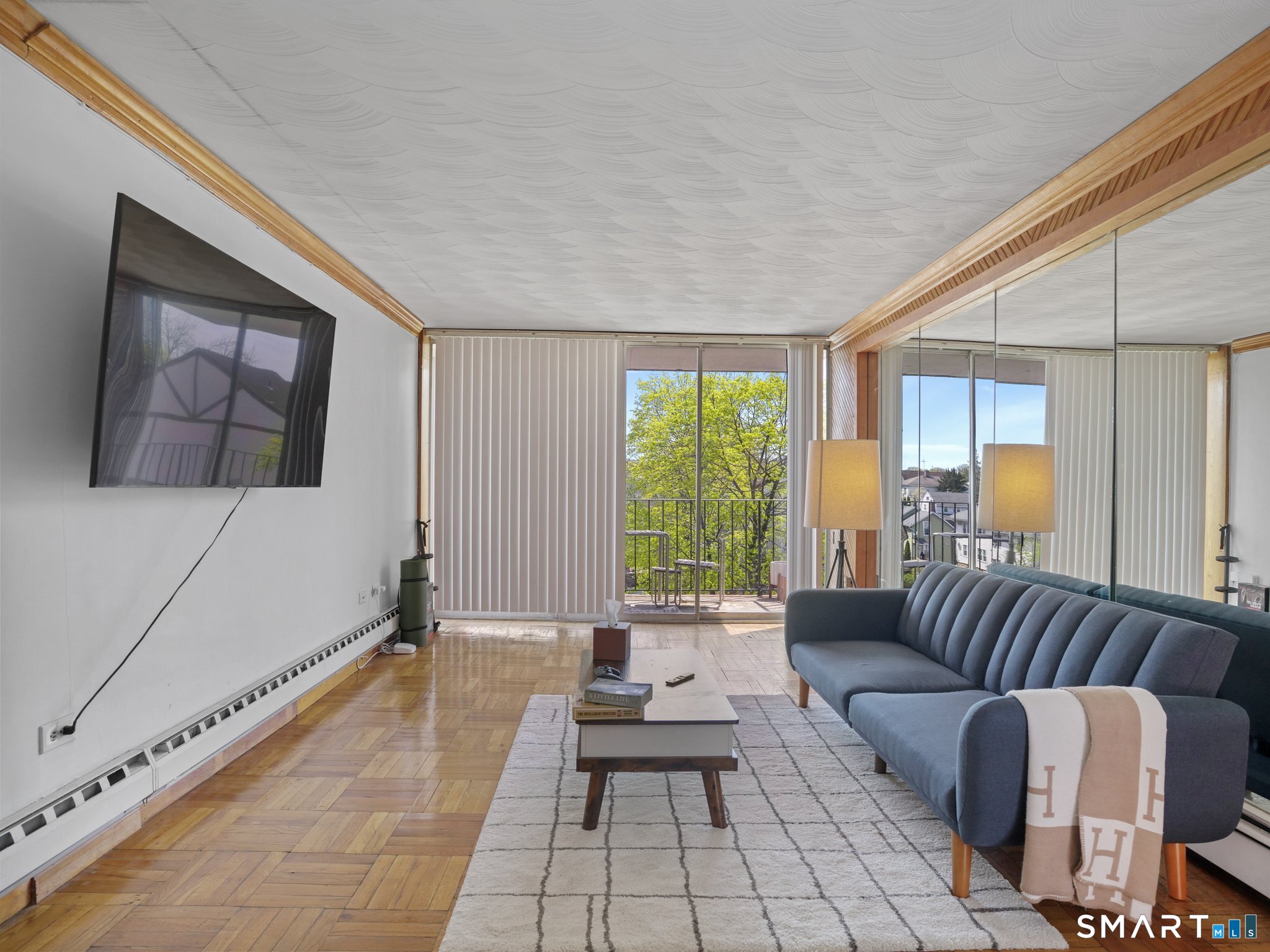 87 Glenbrook Road, Unit 3B Stamford, CT 06902 - Photo 4 of 10 a living room with furniture and a large window