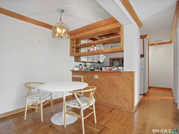 a dining room with a table and chairs
