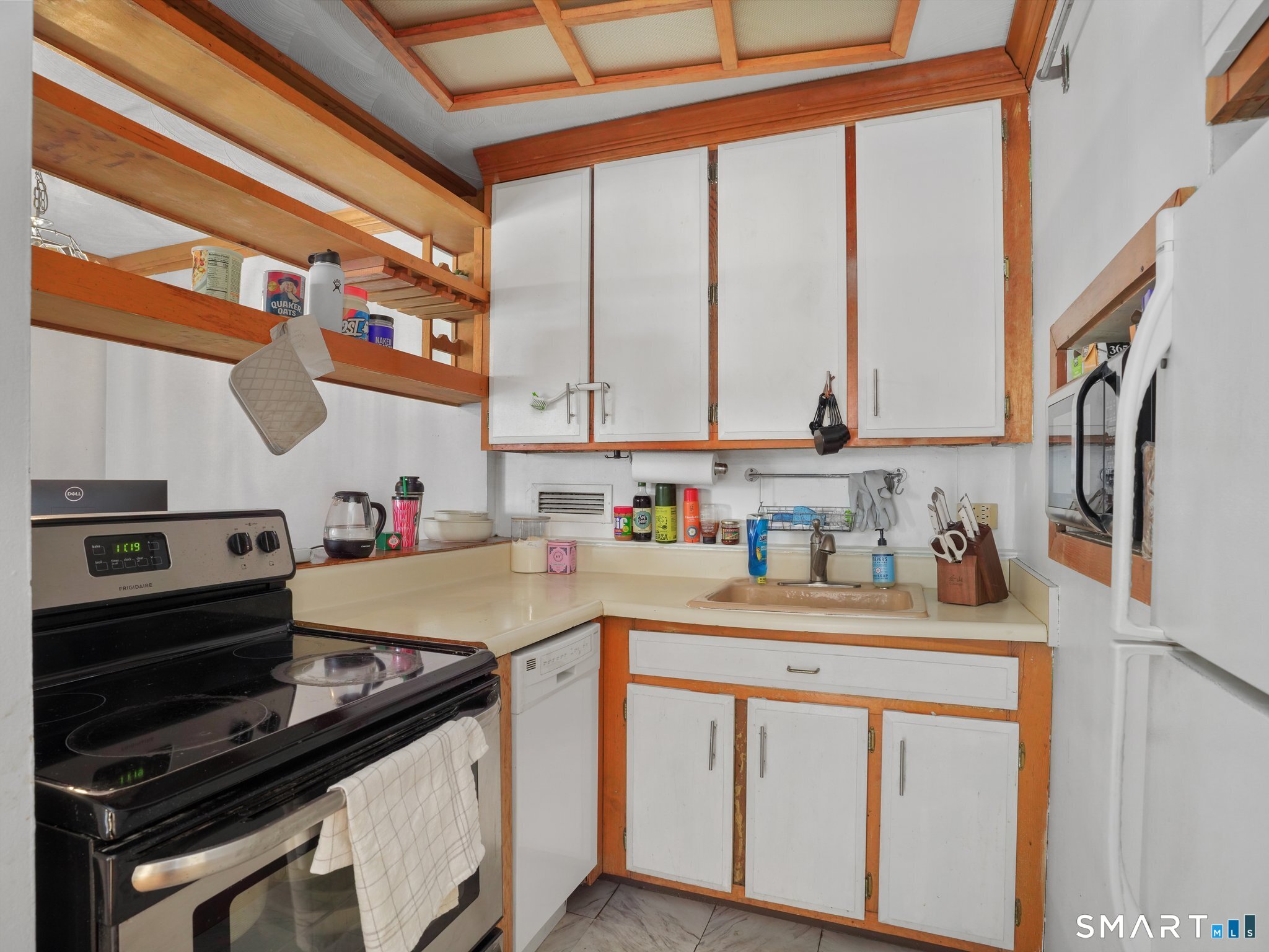 87 Glenbrook Road, Unit 3B Stamford, CT 06902 - Photo 7 of 10 a kitchen with stainless steel appliances a sink a stove and a window