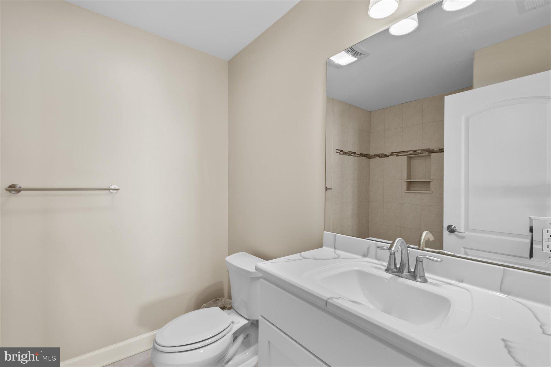 35 Inlet View Court Bethany Beach, DE 19930 - Photo 69 of 74 a bathroom with a sink toilet vanity and shower