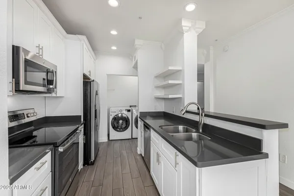 a kitchen with a sink stove and refrigerator