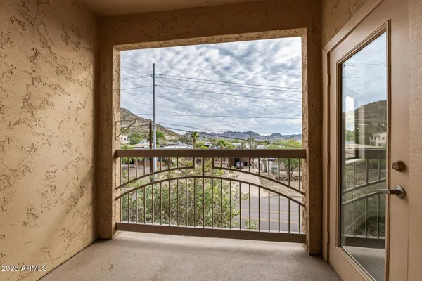 a view of a glass door with a balcony