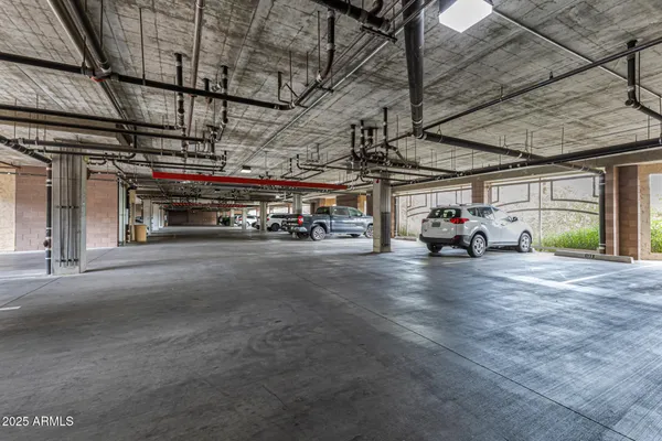 a view of parking garage with cars