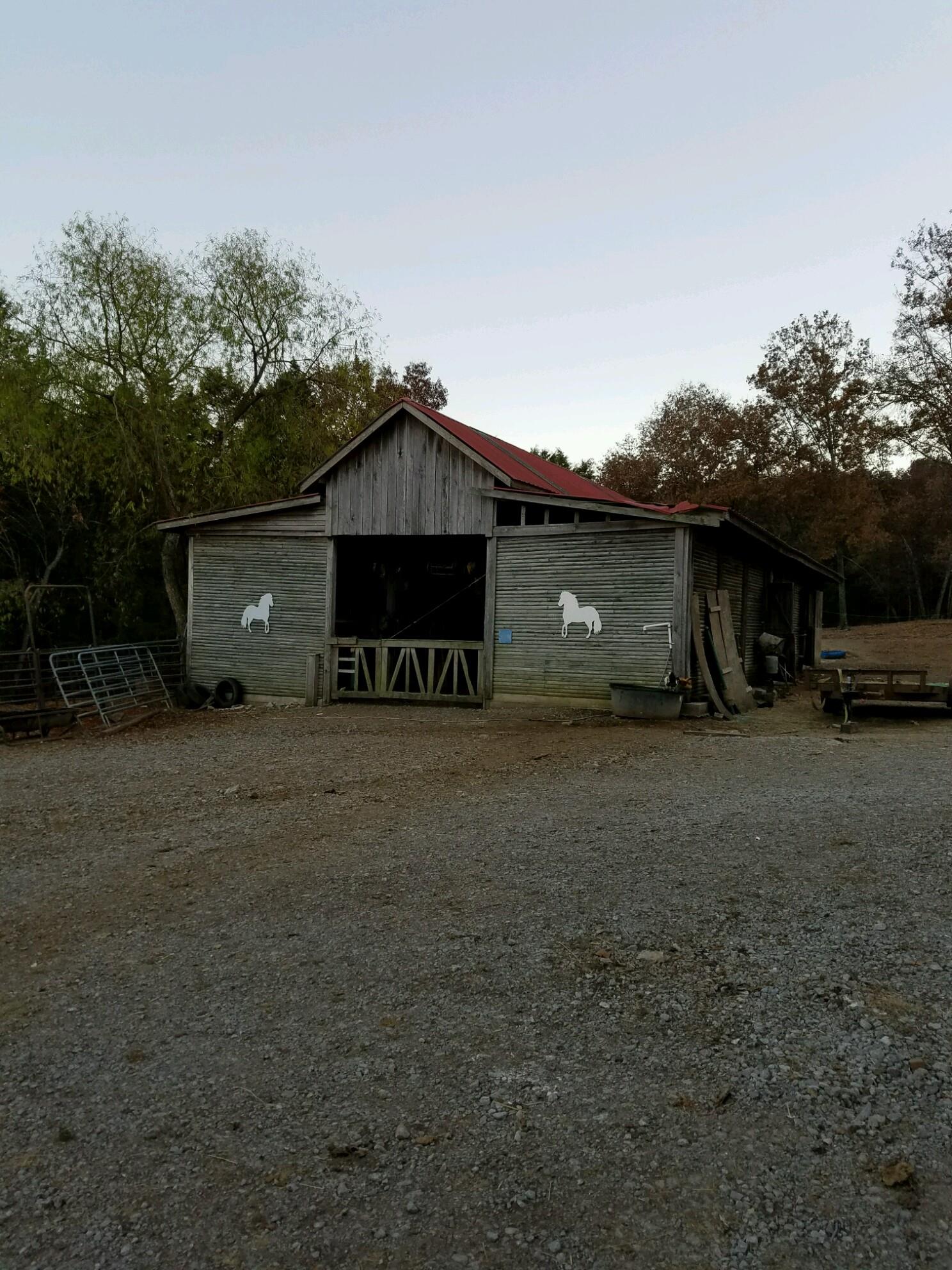 1300 Chicken Road Lebanon, TN 37090 - Photo 5 of 15 a front view of a house with a garden