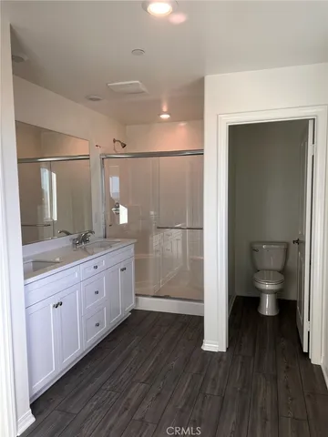 a kitchen with stainless steel appliances a refrigerator and a stove top oven