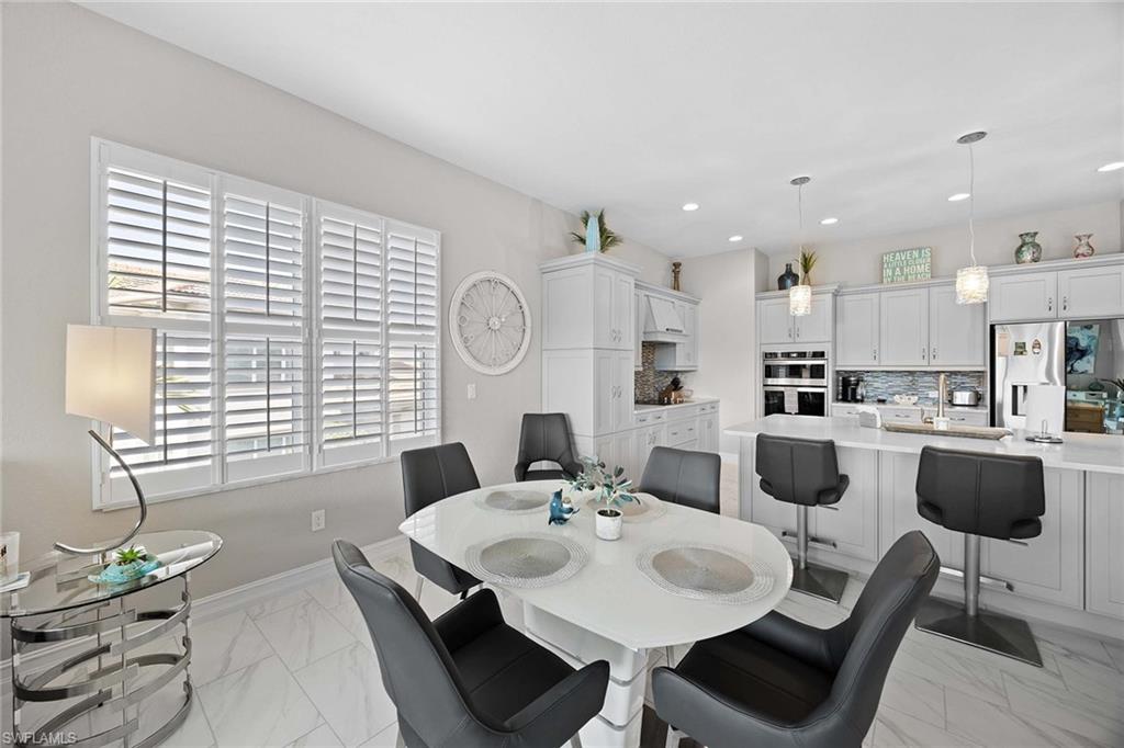7781 Hawthorne Drive, Unit 3204 Naples, FL 34113 - Photo 27 of 50 a view of kitchen with dining area