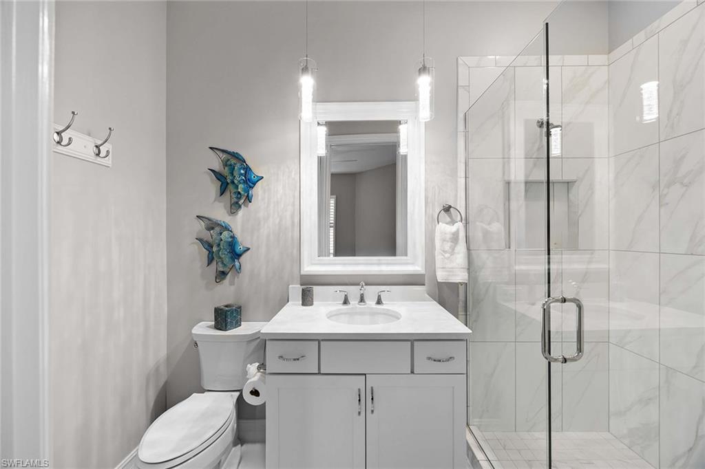 7781 Hawthorne Drive, Unit 3204 Naples, FL 34113 - Photo 29 of 50 a bathroom with a sink toilet and shower