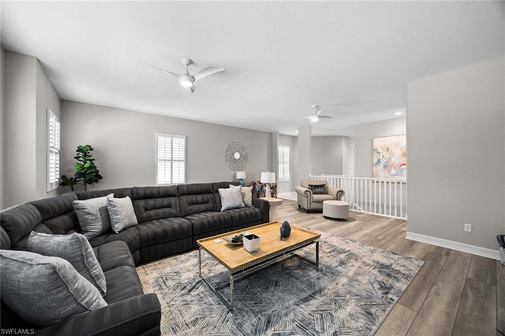 7781 Hawthorne Drive, Unit 3204 Naples, FL 34113 - Photo 35 of 50 a living room with furniture a rug and a window