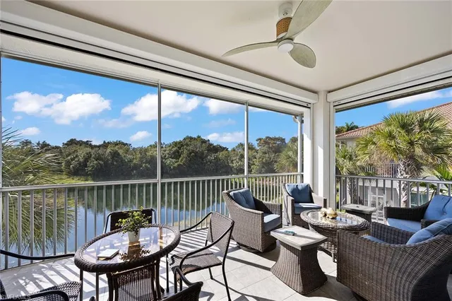 a view of a balcony filled with furniture