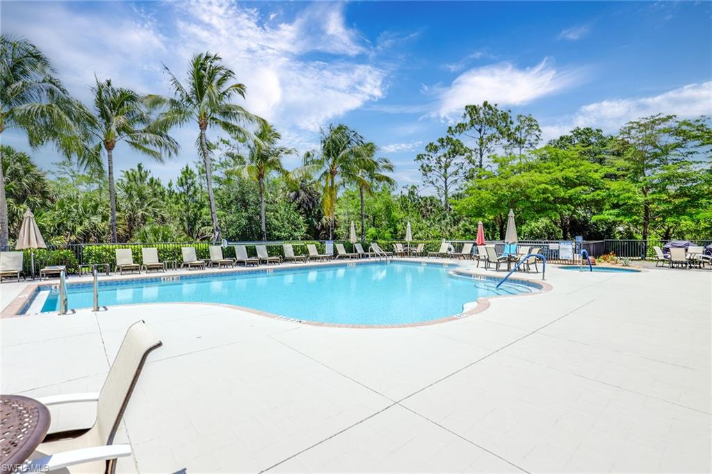 7781 Hawthorne Drive, Unit 3204 Naples, FL 34113 - Photo 41 of 50 a view of a swimming pool with a patio