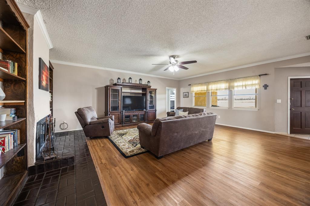 1439 Davis Lane Terrell, TX 75160 - Photo 17 of 33 a living room with furniture and a flat screen tv