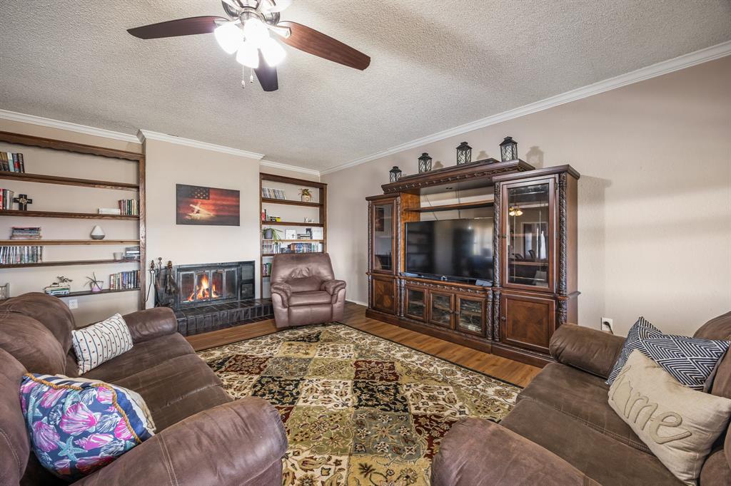 1439 Davis Lane Terrell, TX 75160 - Photo 18 of 33 a living room with furniture and a flat screen tv