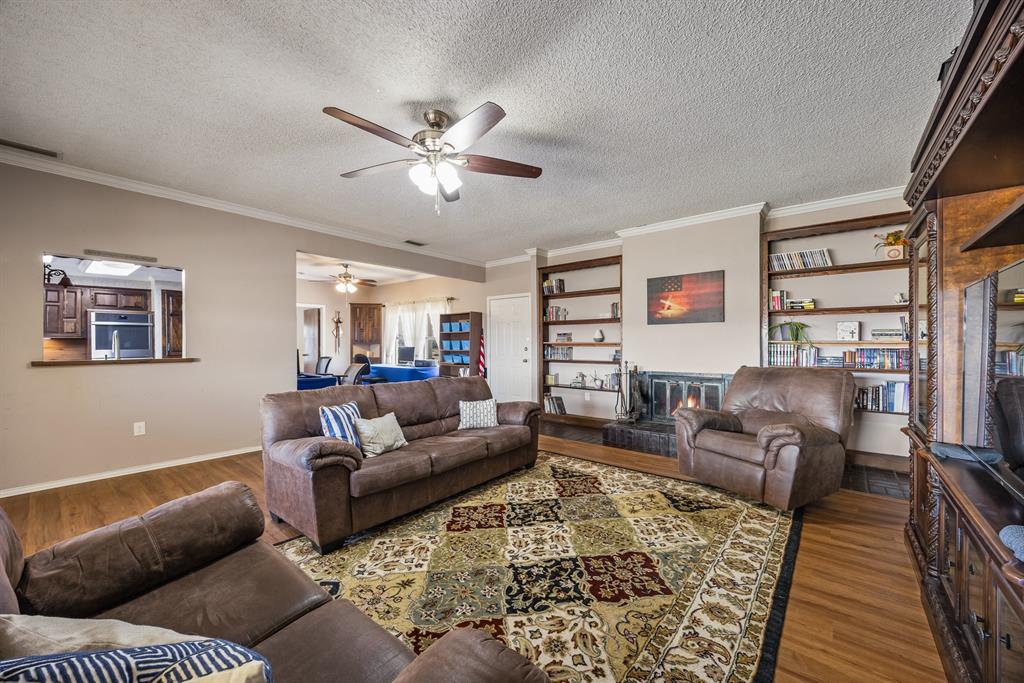 1439 Davis Lane Terrell, TX 75160 - Photo 19 of 33 a living room with furniture and a rug
