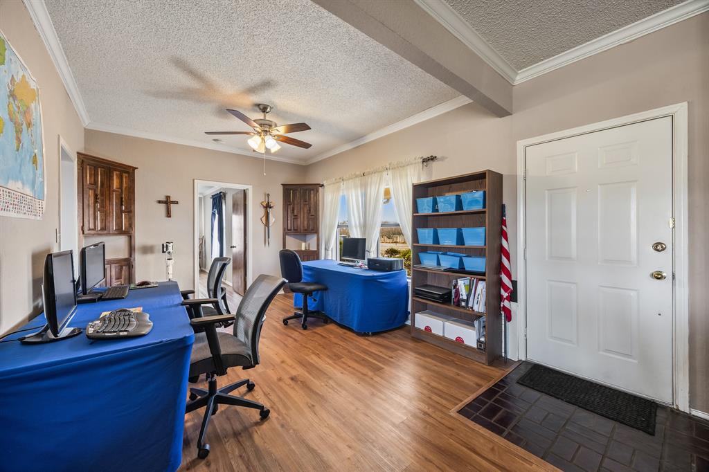 1439 Davis Lane Terrell, TX 75160 - Photo 20 of 33 a living room with furniture and a wooden floor