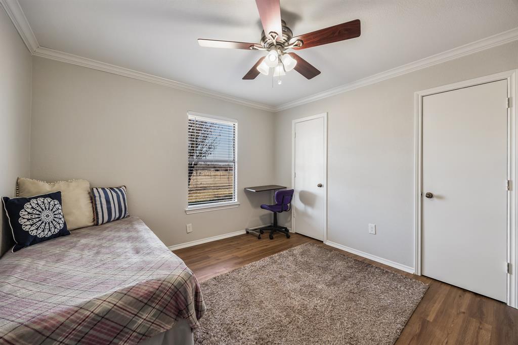 1439 Davis Lane Terrell, TX 75160 - Photo 23 of 33 a bedroom with a bed and a window