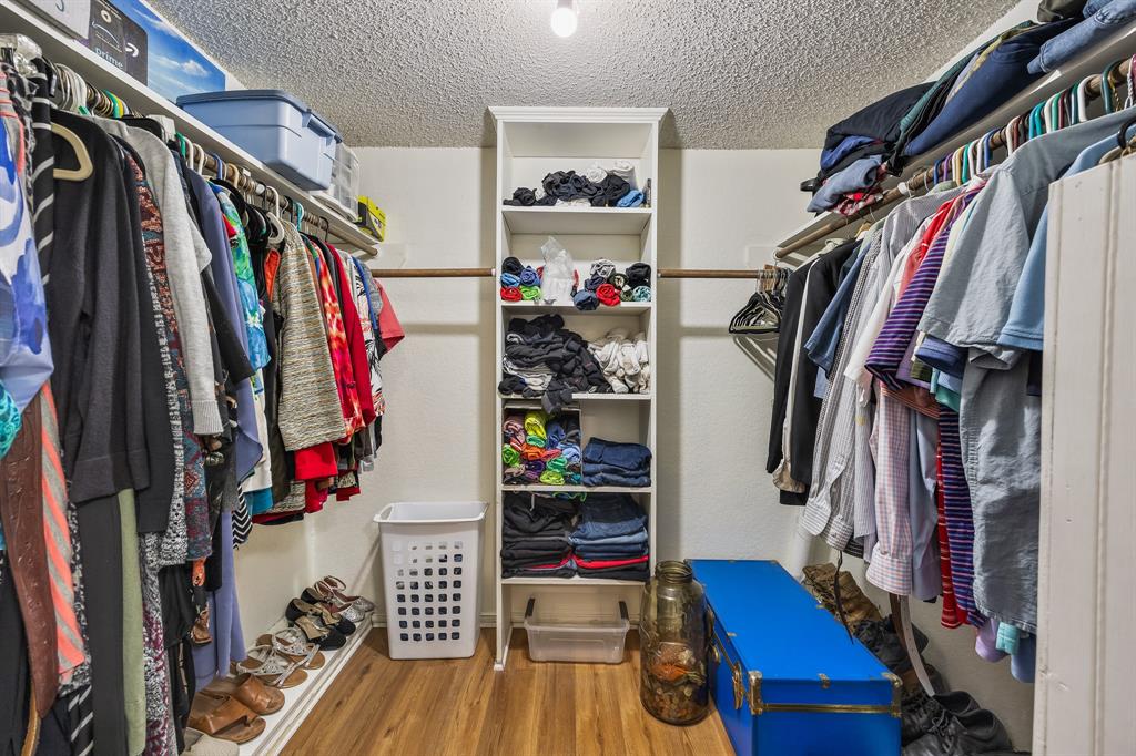 1439 Davis Lane Terrell, TX 75160 - Photo 26 of 33 a view of walk in closet with clothes and shoes