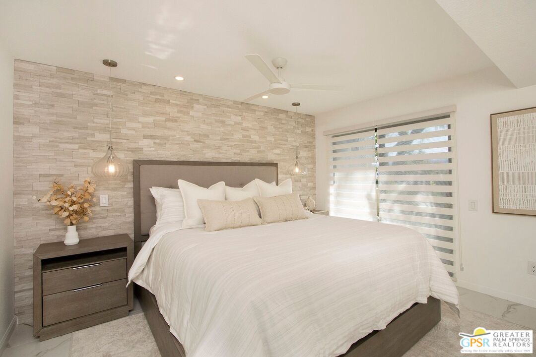 1100 East Amado Road, Unit 13C1 Palm Springs, CA 92262 - Photo 12 of 36 a bedroom with a bed and a window
