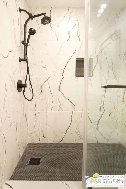 1100 East Amado Road, Unit 13C1 Palm Springs, CA 92262 - Photo 27 of 36 a picture of a glass door with a window