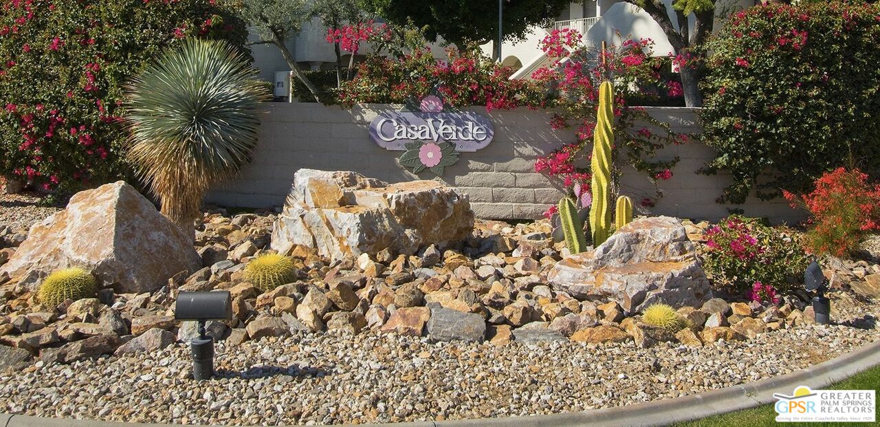 1100 East Amado Road, Unit 13C1 Palm Springs, CA 92262 - Photo 36 of 36 a vase of flowers sitting on a table